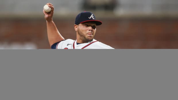 Sep 19, 2023; Atlanta, Georgia, USA; Atlanta Braves relief pitcher Joe Jimenez (77) throws against the Philadelphia Phillies in the ninth inning at Truist Park.